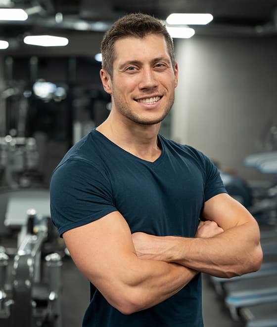 Fitness trainer standing in a gym